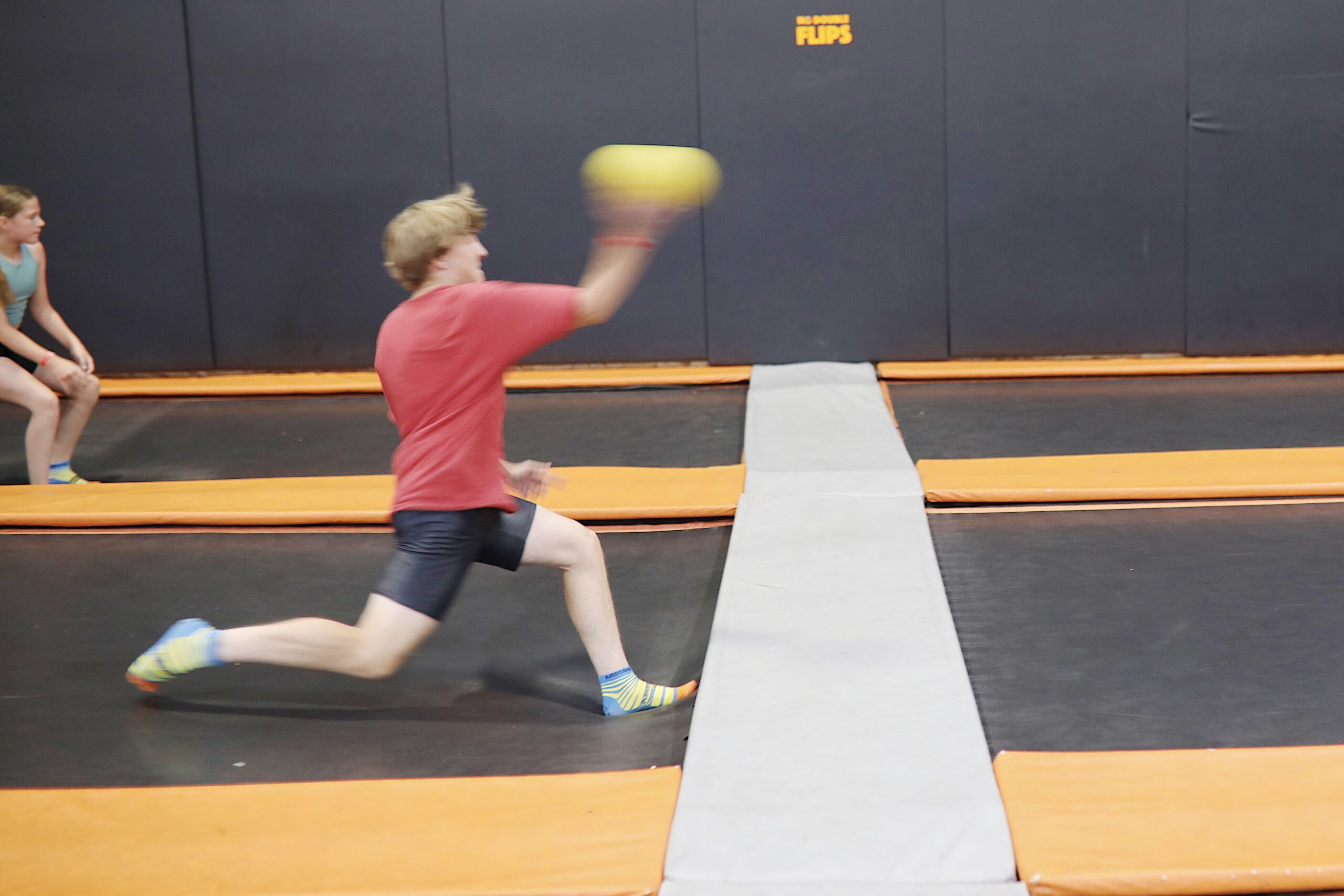 Action-packed image of airborne dodgeball game 