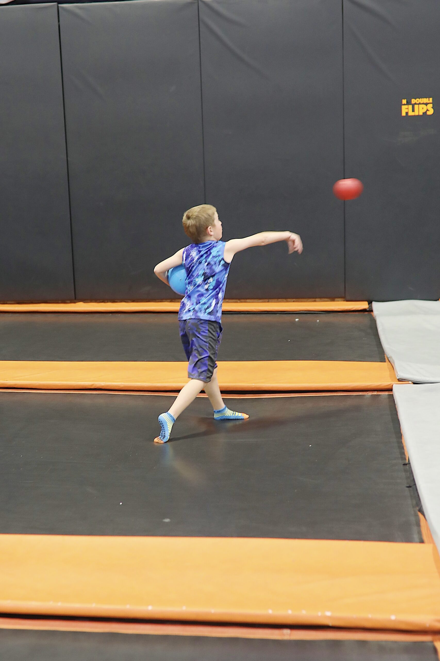 Action-packed image of airborne dodgeball game 